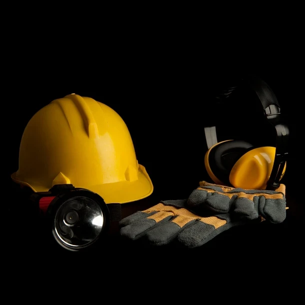 yellow-safety-helmet-leather-glove-headphone-head-lamp-black-background-2